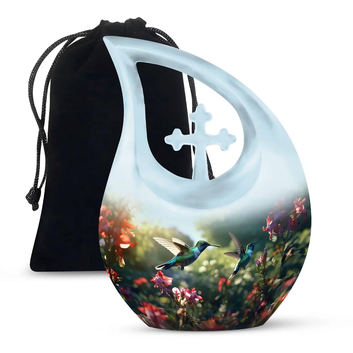 Crescent moon–shaped decorative piece with a cutout cross at the top, featuring an illustration of two hummingbirds flying among colorful flowers, shown in front of a black drawstring pouch.