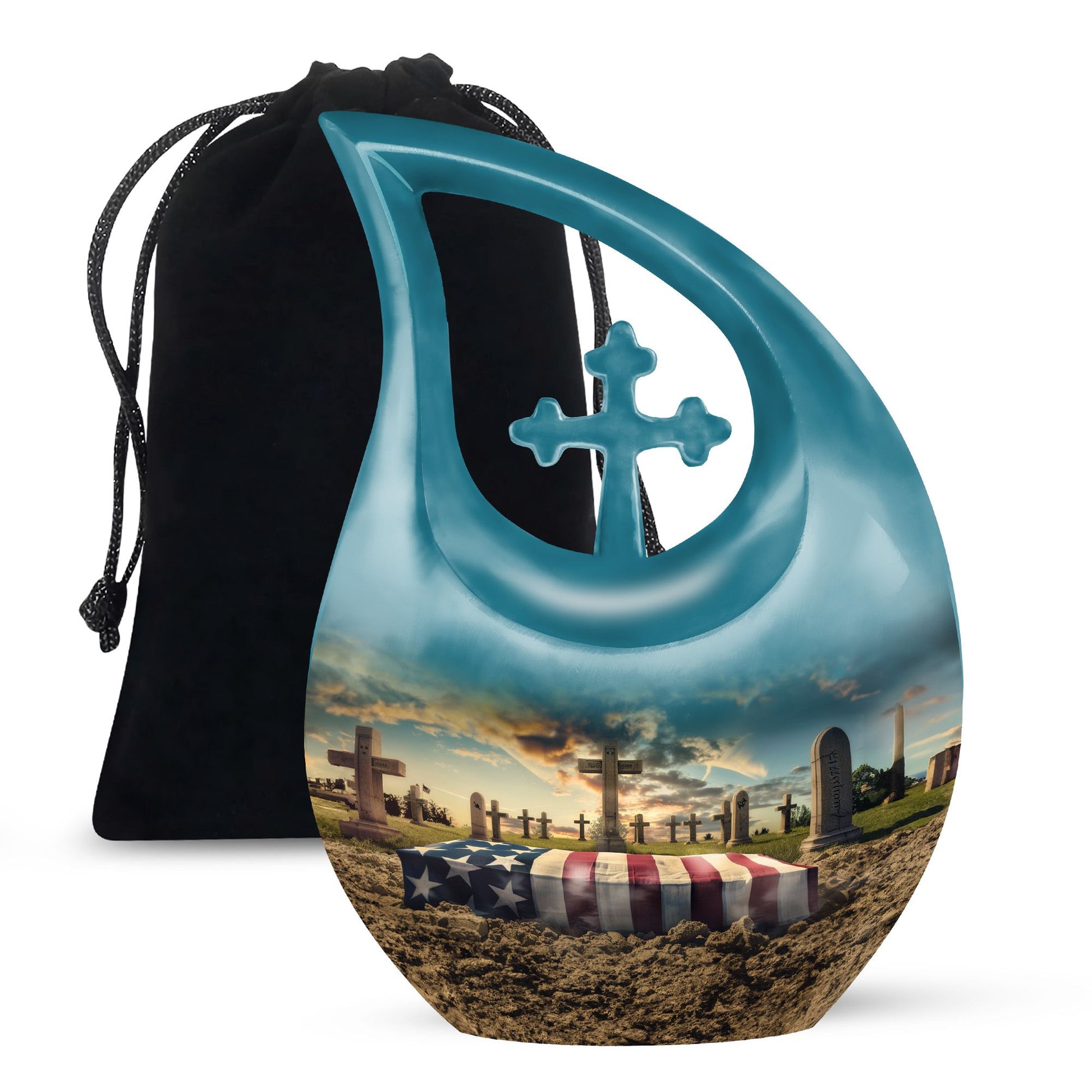 Teal urn with cross design on a black drawstring bag, featuring a scenic design of a cemetery with an American flag.