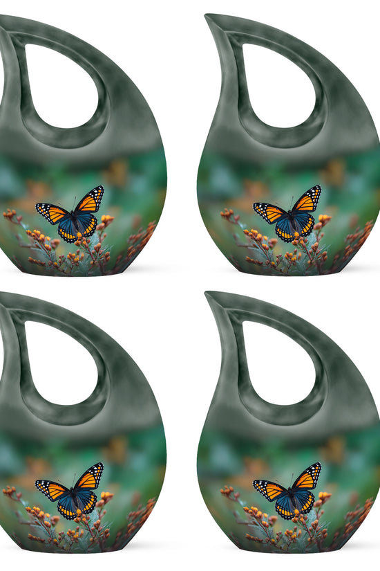 Olive Green Butterfly Cremation Urn lifestyle display on memorial shelf - devotional cross-drop butterfly engraving - 10 inch aluminum urn for cremated remains