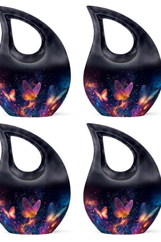 Jet Black Butterfly Cremation Urn lifestyle display on memorial shelf - sacred cross merged with butterfly motif on metal - 10 inch aluminum urn for cremated remains