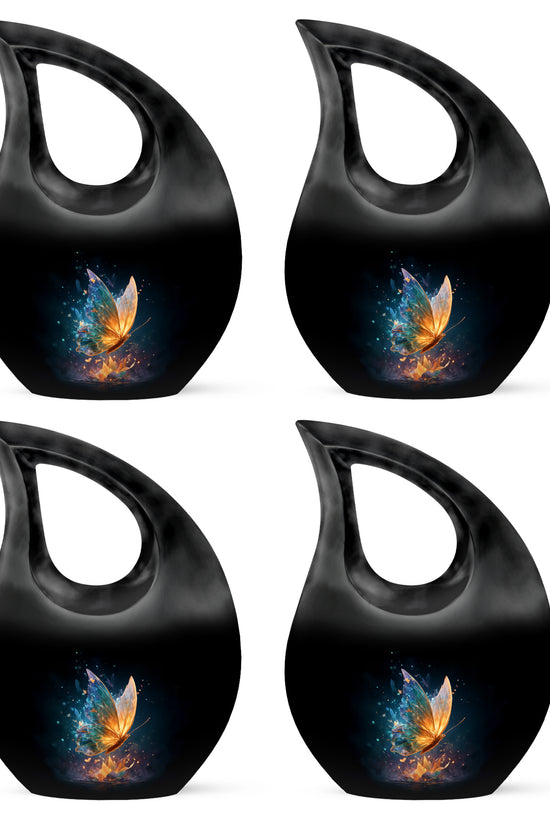 Obsidian Black Butterfly Cremation Urn lifestyle display on memorial shelf - devotional cross-drop butterfly engraving - 10 inch aluminum urn for cremated remains