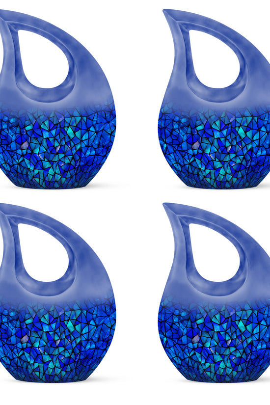 Azure Blue Cremation Urn lifestyle display on memorial shelf - cross and blue combined in spiritual memorial design - 10 inch aluminum urn for cremated remains