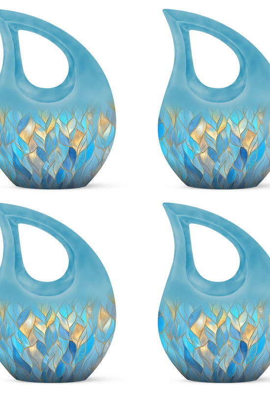 Powder Blue Blue Cremation Urn lifestyle display on memorial shelf - sacred cross merged with blue motif on metal - 10 inch aluminum urn for cremated remains