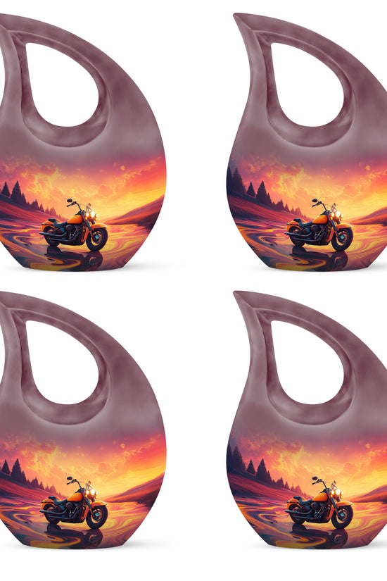 Salmon Pink Bike Cremation Urn lifestyle display on memorial shelf - faith-inspired cross-drop urn with bike pattern - 10 inch aluminum urn for cremated remains