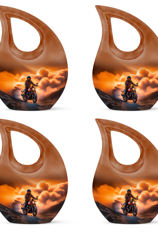 Sunrise Gold Bike Cremation Urn lifestyle display on memorial shelf - cross and bike combined in spiritual memorial design - 10 inch aluminum urn for cremated remains
