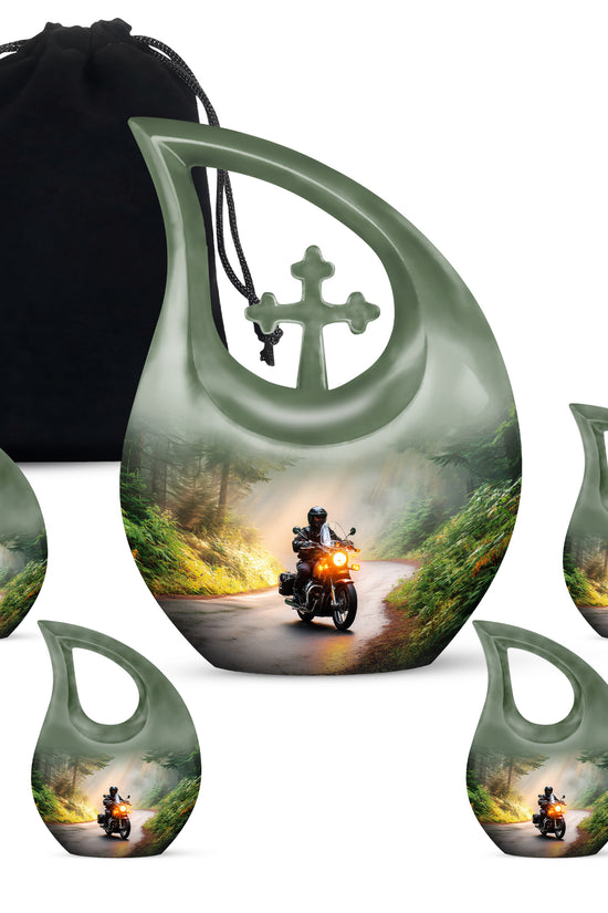 Gilded Gold Bike Cremation Urn urn with complimentary velvet bag - cross and bike combined in spiritual memorial design - memorial set with one large and four small urns