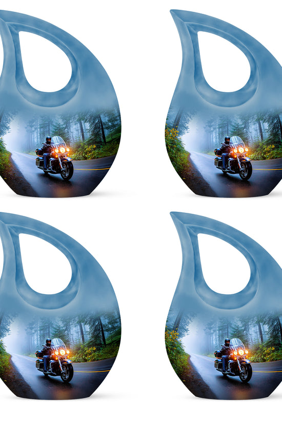 Cobalt Blue Bike Cremation Urn lifestyle display on memorial shelf - faith-inspired cross-drop urn with bike pattern - 10 inch aluminum urn for cremated remains