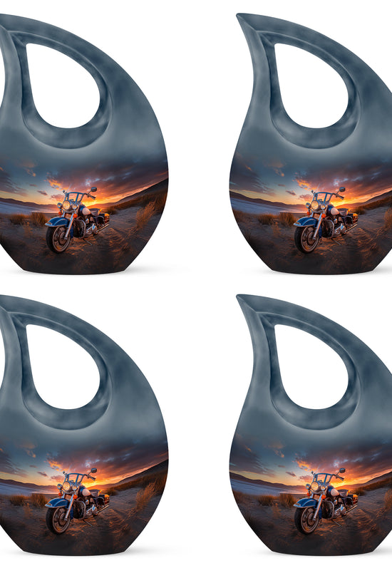 Rich Black Bike Cremation Urn lifestyle display on memorial shelf - sacred cross merged with bike motif on metal - 10 inch aluminum urn for cremated remains