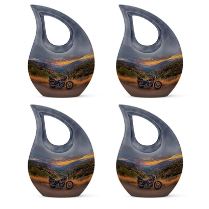 Cornflower Blue Bike Cremation Urn lifestyle display on memorial shelf - devotional cross-drop bike engraving - 10 inch aluminum urn for cremated remains
