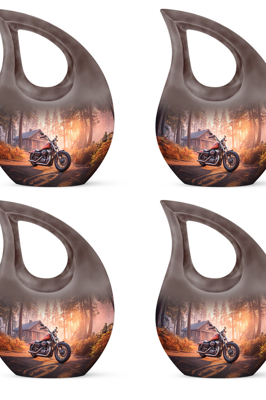 Crimson Red Bike Cremation Urn lifestyle display on memorial shelf - sacred cross merged with bike motif on metal - 10 inch aluminum urn for cremated remains