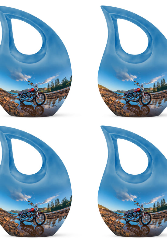 Serene Blue Bike Cremation Urn lifestyle display on memorial shelf - devotional cross-drop bike engraving - 10 inch aluminum urn for cremated remains