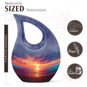 Icy Blue Beach Cremation Urn back view with polished surface - sacred cross merged with beach motif on metal - mini keepsake memorial for portion of cremation ashes