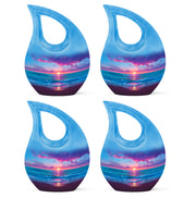 Icy Blue Beach Cremation Urn lifestyle display on memorial shelf - cross and beach combined in spiritual memorial design - 10 inch aluminum urn for cremated remains