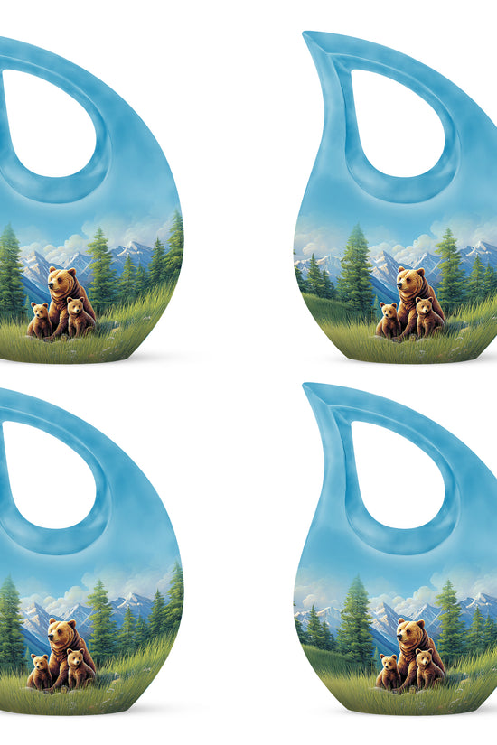 Azure Bear Cremation Urn lifestyle display on memorial shelf - sacred cross merged with bear motif on metal - 10 inch aluminum urn for cremated remains