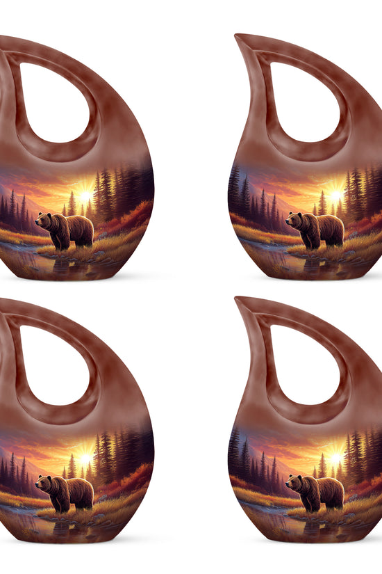 Burgundy Red Bear Cremation Urn lifestyle display on memorial shelf - sacred cross merged with bear motif on metal - 10 inch aluminum urn for cremated remains