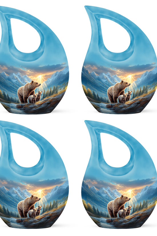 Azure Bear Cremation Urn lifestyle display on memorial shelf - cross and bear combined in spiritual memorial design - 10 inch aluminum urn for cremated remains