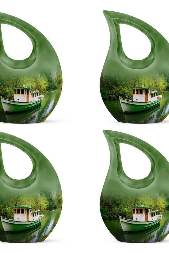 Sage Green Boat Cremation Urn lifestyle display on memorial shelf - sacred cross merged with boat motif on metal - 10 inch aluminum urn for cremated remains