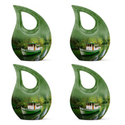 Sage Green Boat Cremation Urn lifestyle display on memorial shelf - sacred cross merged with boat motif on metal - 10 inch aluminum urn for cremated remains