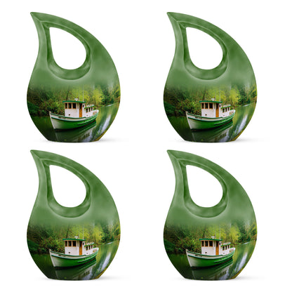 Sage Green Boat Cremation Urn lifestyle display on memorial shelf - sacred cross merged with boat motif on metal - 10 inch aluminum urn for cremated remains