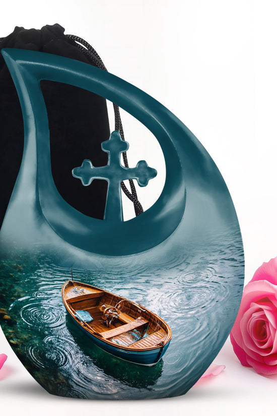 Soft Teal Boat Cremation Urn top-down view of secure threaded lid - cross and boat combined in spiritual memorial design - full-size 10 inch 200 cubic inch adult cremation urn