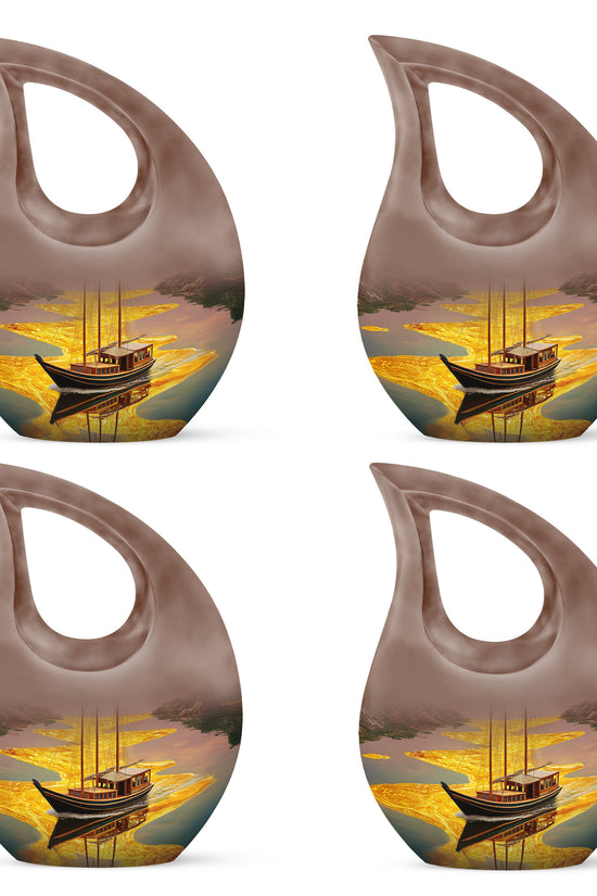 Champagne Gold Boat Cremation Urn lifestyle display on memorial shelf - sacred cross merged with boat motif on metal - 10 inch aluminum urn for cremated remains