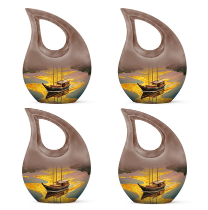 Champagne Gold Boat Cremation Urn lifestyle display on memorial shelf - sacred cross merged with boat motif on metal - 10 inch aluminum urn for cremated remains