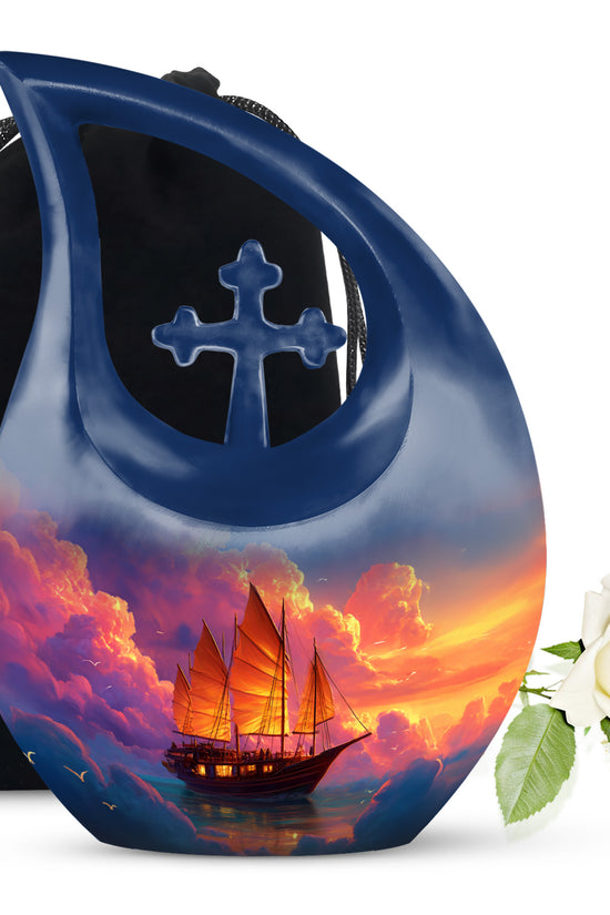Sky Blue Boat Cremation Urn top-down view of secure threaded lid - sacred cross merged with boat motif on metal - full-size 10 inch 200 cubic inch adult cremation urn