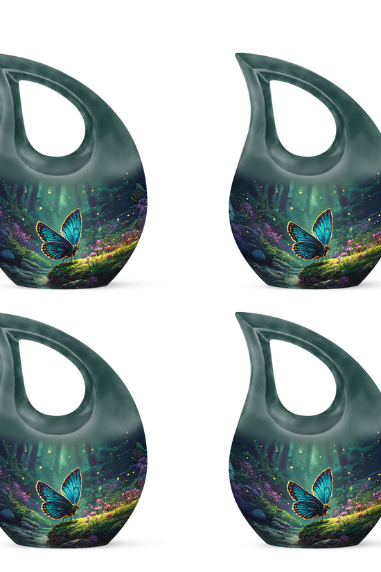 Soft Teal Butterfly Cremation Urn lifestyle display on memorial shelf - sacred cross merged with butterfly motif on metal - 10 inch aluminum urn for cremated remains