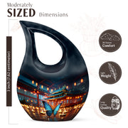 Slate Blue Butterfly Cremation Urn back view with polished surface - sacred cross merged with butterfly motif on metal - mini keepsake memorial for portion of cremation ashes