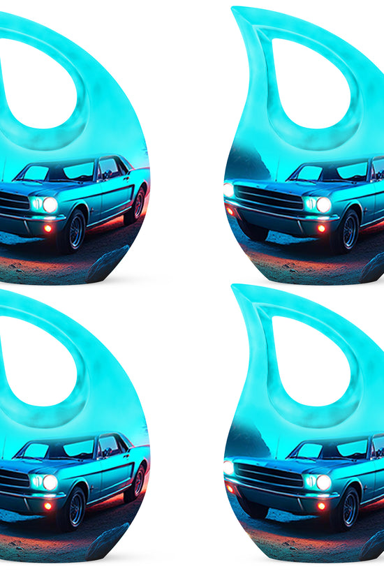 Slate Blue Car Cremation Urn lifestyle display on memorial shelf - sacred cross merged with car motif on metal - 10 inch aluminum urn for cremated remains