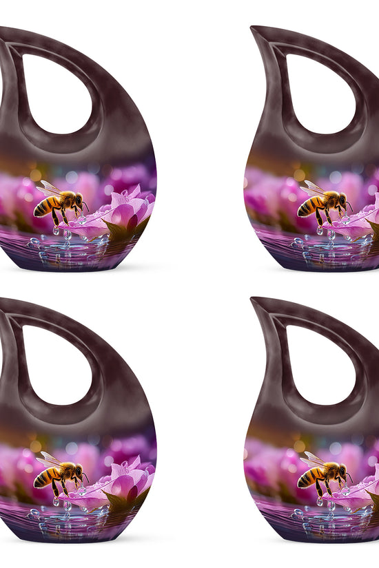Wine Red Bee Cremation Urn lifestyle display on memorial shelf - sacred cross merged with bee motif on metal - 10 inch aluminum urn for cremated remains