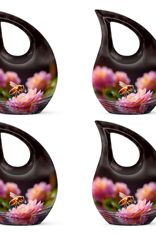 Dark Black Bee Cremation Urn lifestyle display on memorial shelf - devotional cross-drop bee engraving - 10 inch aluminum urn for cremated remains