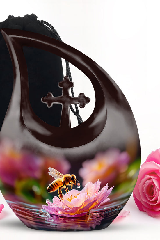 Rich Black Bee Cremation Urn top-down view of secure threaded lid - sacred cross merged with bee motif on metal - full-size 10 inch 200 cubic inch adult cremation urn