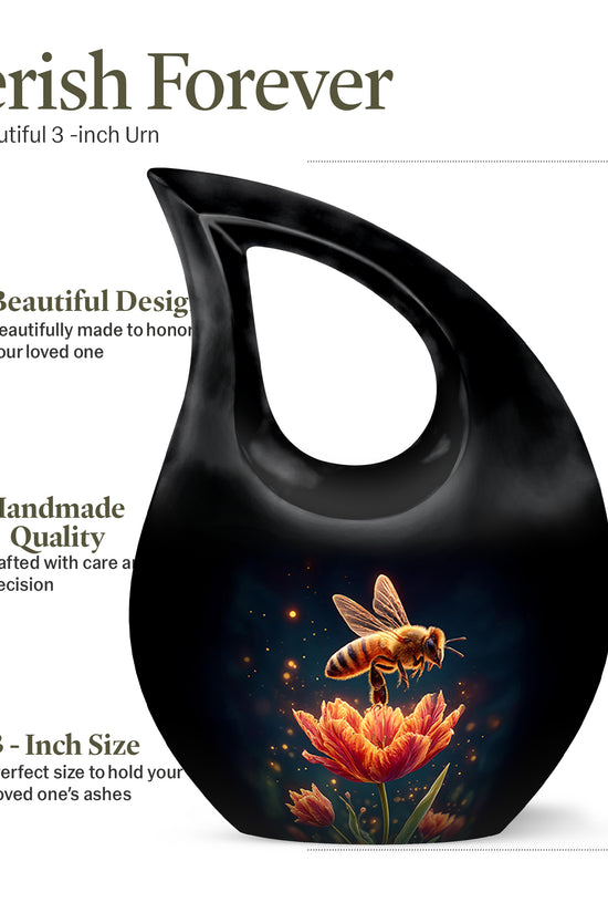 Ebony Bee Cremation Urn back view with polished surface - sacred cross merged with bee motif on metal - mini keepsake memorial for portion of cremation ashes