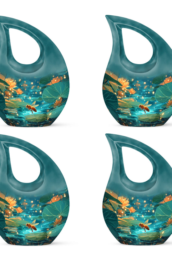 Sea Green Teal Bee Cremation Urn lifestyle display on memorial shelf - sacred cross merged with bee motif on metal - 10 inch aluminum urn for cremated remains