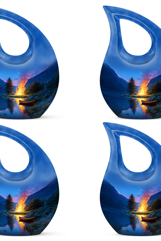 Navy Blue Campfire Cremation Urn lifestyle display on memorial shelf - sacred cross merged with campfire motif on metal - 10 inch aluminum urn for cremated remains