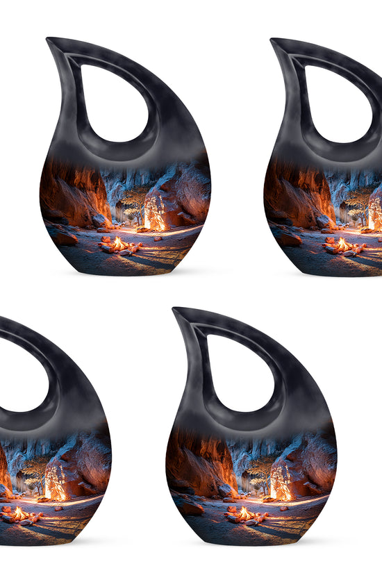 Twilight Blue Campfire Cremation Urn lifestyle display on memorial shelf - faith-inspired cross-drop urn with campfire pattern - 10 inch aluminum urn for cremated remains