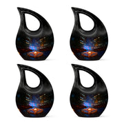 Glossy Black Campfire Cremation Urn lifestyle display on memorial shelf - cross and campfire combined in spiritual memorial design - 10 inch aluminum urn for cremated remains