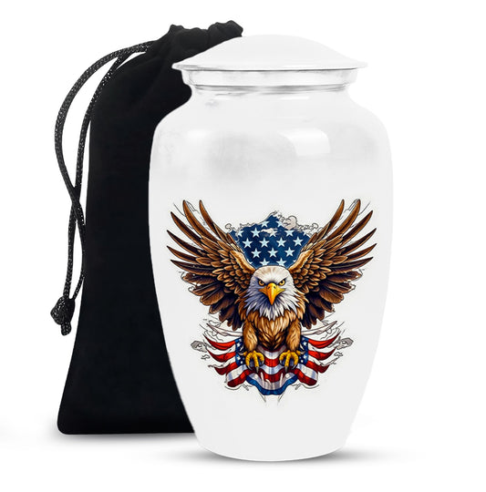 White urn with an eagle and American flag design, accompanied by a black drawstring bag.