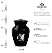 Glossy Black Butterfly Cremation Urn close-up of engraving and surface detail - classic sculpted butterfly pattern on smooth aluminum - mini keepsake memorial for portion of cremation ashes