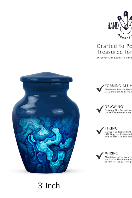 Icy Blue Blue Cremation Urn close-up of engraving and surface detail - classic sculpted blue pattern on smooth aluminum - mini keepsake memorial for portion of cremation ashes