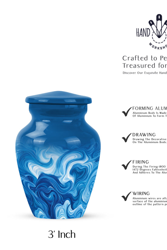 Pastel Blue Blue Cremation Urn close-up of engraving and surface detail - classic sculpted blue pattern on smooth aluminum - mini keepsake memorial for portion of cremation ashes