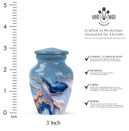 Indigo Blue Cremation Urn close-up of engraving and surface detail - classic sculpted blue pattern on smooth aluminum - mini keepsake memorial for portion of cremation ashes