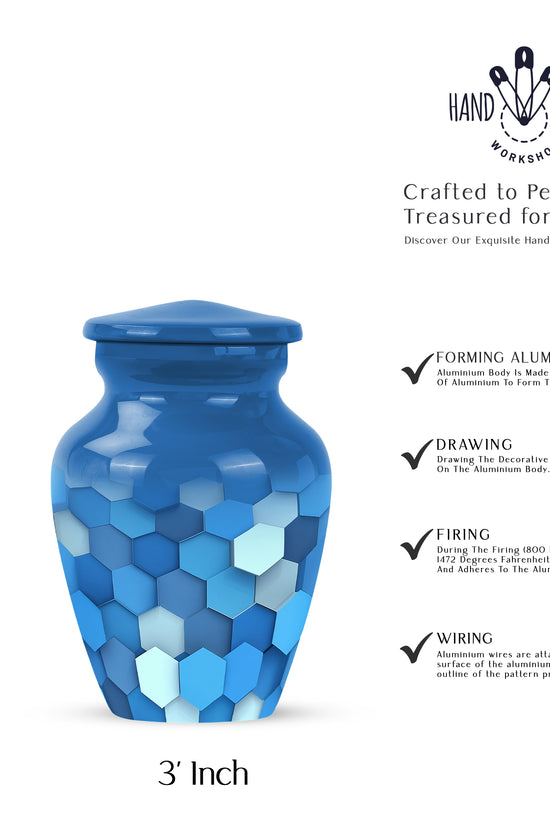 Misty Blue Blue Cremation Urn close-up of engraving and surface detail - classic sculpted blue pattern on smooth aluminum - mini keepsake memorial for portion of cremation ashes