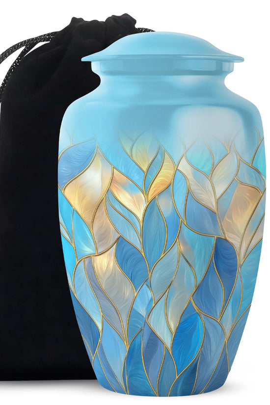 Sky Blue Blue Cremation Urn angled view of lid and engraved motif - timeless blue motif etched into premium metal - full-size 10 inch 200 cubic inch adult cremation urn