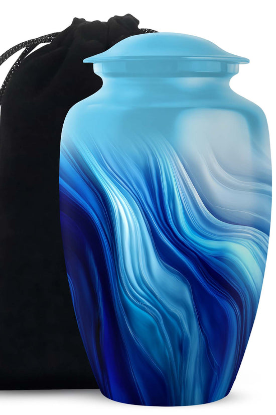 Icy Blue Blue Cremation Urn angled view of lid and engraved motif - timeless blue motif etched into premium metal - full-size 10 inch 200 cubic inch adult cremation urn