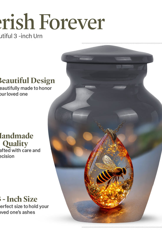 Obsidian Black Bee Cremation Urn close-up of engraving and surface detail - elegant classic bee relief with fine detailing - mini keepsake memorial for portion of cremation ashes