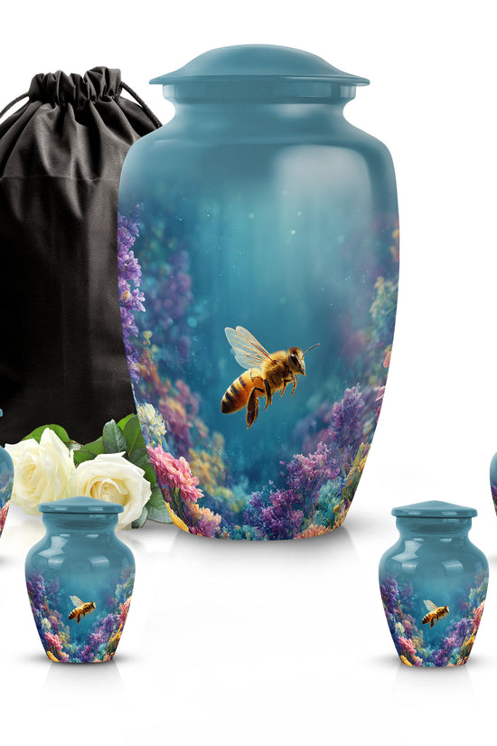 Soft Teal Bee Cremation Urn top-down view of secure threaded lid - classic sculpted bee pattern on smooth aluminum - memorial set with one large and four small urns