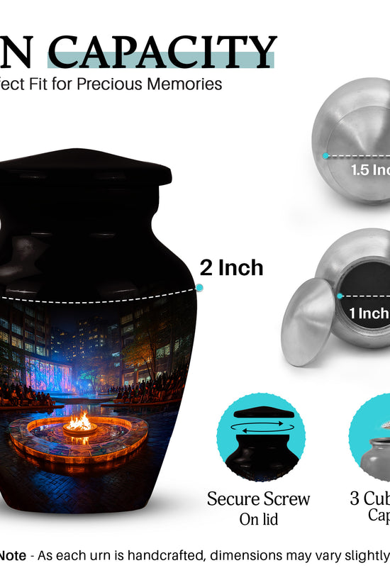 Rich Black Campfire Cremation Urn close-up of engraving and surface detail - classic sculpted campfire pattern on smooth aluminum - mini keepsake memorial for portion of cremation ashes
