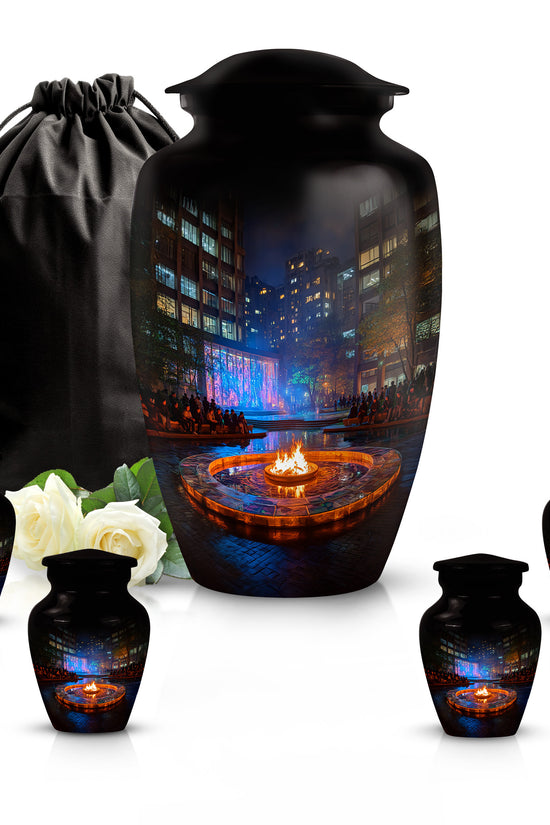 Rich Black Campfire Cremation Urn top-down view of secure threaded lid - classic sculpted campfire pattern on smooth aluminum - memorial set with one large and four small urns